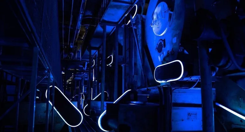 Curved light installation in an industrial space